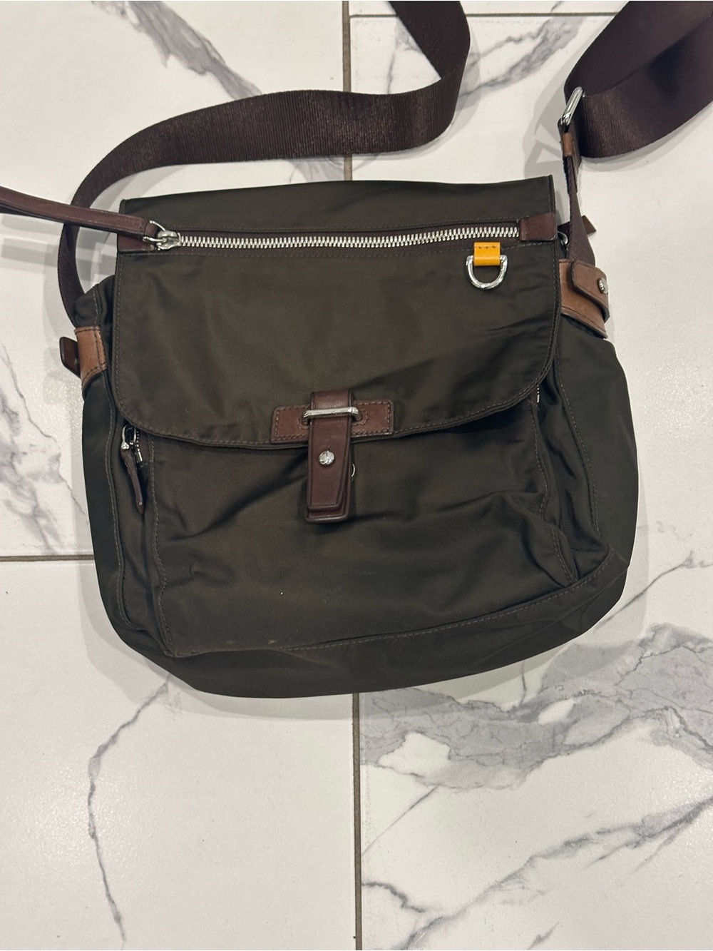 Tumi Olive Green Crossbody Bag with Brown Trim and Yellow Accent